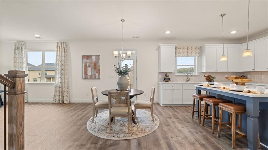 1784 Goodwin Drive Hampton, GA 30228 - Photo 19 of 56 a kitchen with refrigerator and chairs