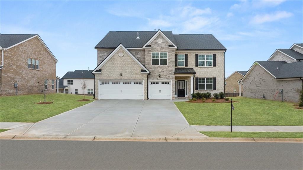 1784 Goodwin Drive Hampton, GA 30228 - Photo 2 of 56 front view of a house with a yard