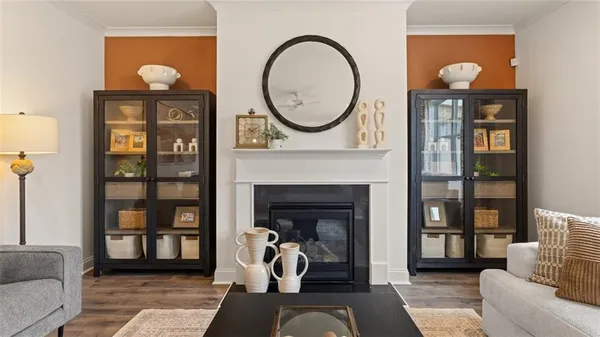 a living room with furniture a window and a fireplace