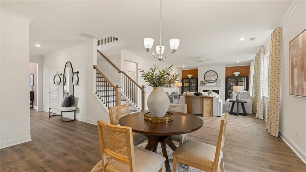 1784 Goodwin Drive Hampton, GA 30228 - Photo 26 of 56 a view of a dining room with furniture and wooden floor