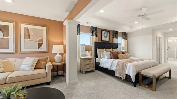 a living room with furniture a mirror and a lamp