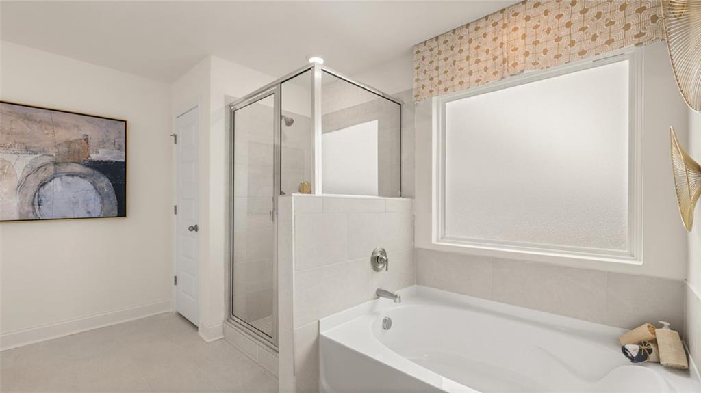 1784 Goodwin Drive Hampton, GA 30228 - Photo 41 of 56 a bathroom with a bathtub and a shower