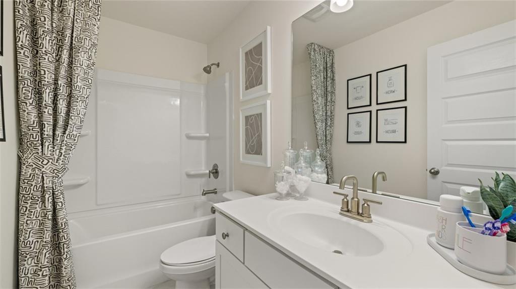 1784 Goodwin Drive Hampton, GA 30228 - Photo 49 of 56 a bathroom with a sink a toilet and shower