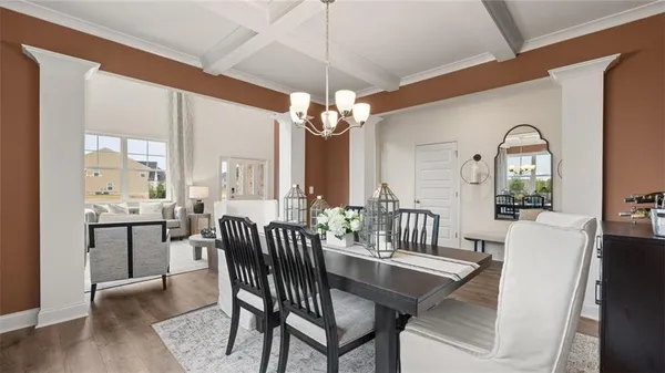a view of a dining room with furniture window and wooden floor