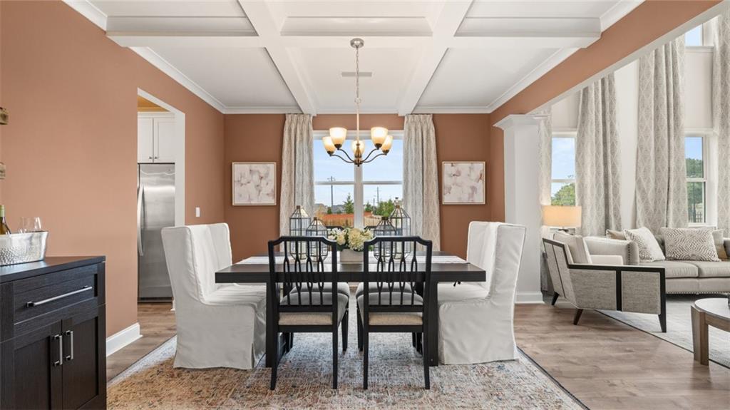 1784 Goodwin Drive Hampton, GA 30228 - Photo 9 of 56 a view of a dining room with furniture large windows and wooden floor