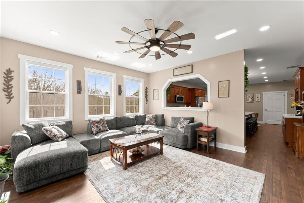 152 Grover Taylor Road Demorest, GA 30535 - Photo 18 of 68 a living room with furniture a rug and a flat screen tv