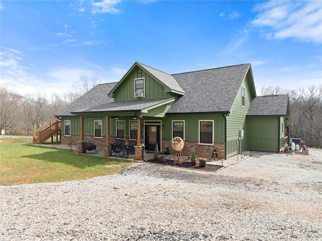 152 Grover Taylor Road Demorest, GA 30535 - Photo 2 of 68 a view of a house with garden and sitting area