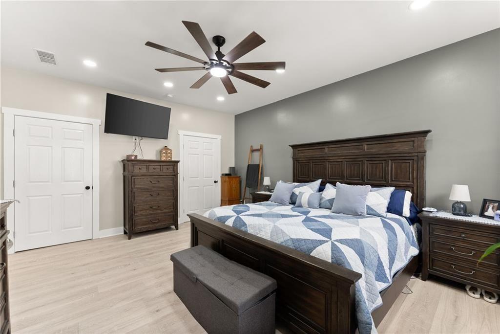 152 Grover Taylor Road Demorest, GA 30535 - Photo 26 of 68 a bedroom with a bed and a television