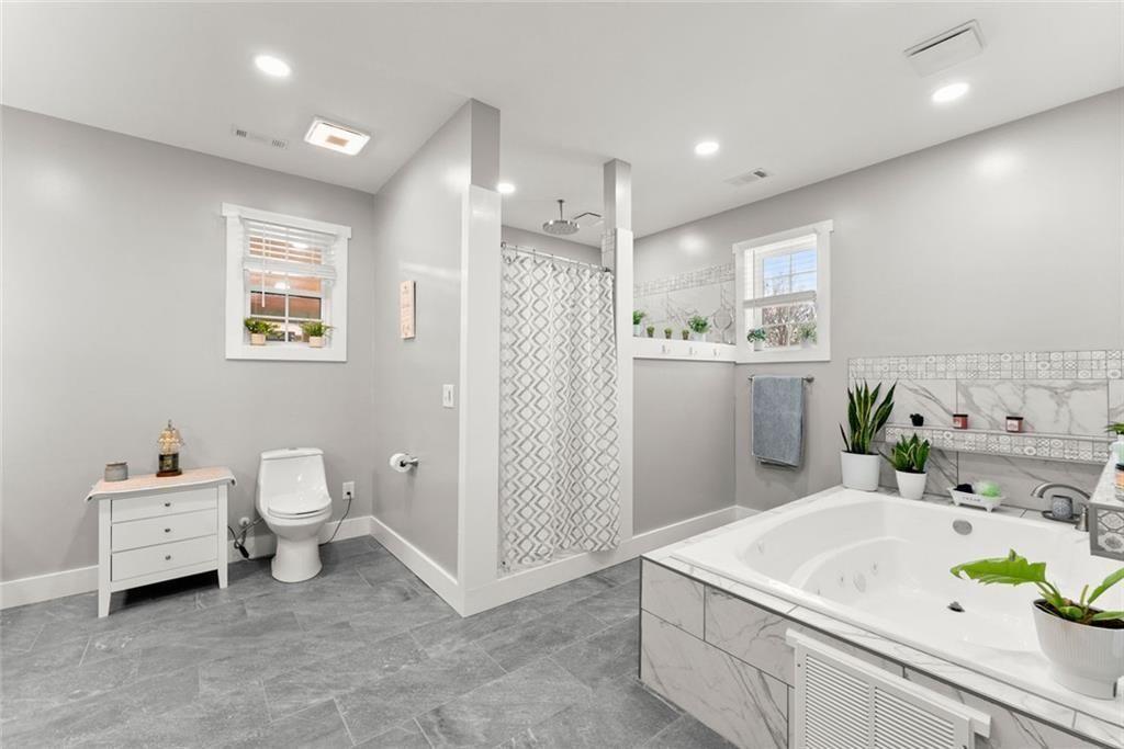 152 Grover Taylor Road Demorest, GA 30535 - Photo 28 of 68 a bathroom with a sink a toilet and shower