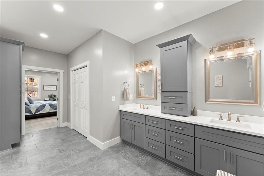 152 Grover Taylor Road Demorest, GA 30535 - Photo 30 of 68 a spacious bathroom with a double vanity sink and a mirror