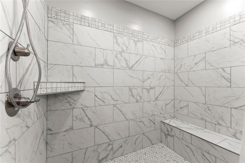 152 Grover Taylor Road Demorest, GA 30535 - Photo 34 of 68 a bathroom with a bathtub and a shower