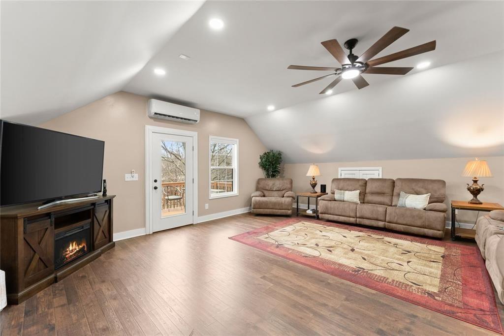 152 Grover Taylor Road Demorest, GA 30535 - Photo 36 of 68 a living room with furniture and a flat screen tv