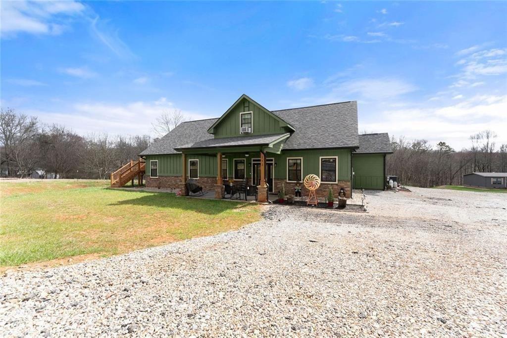 152 Grover Taylor Road Demorest, GA 30535 - Photo 4 of 68 a front view of a house with a yard patio and swimming pool