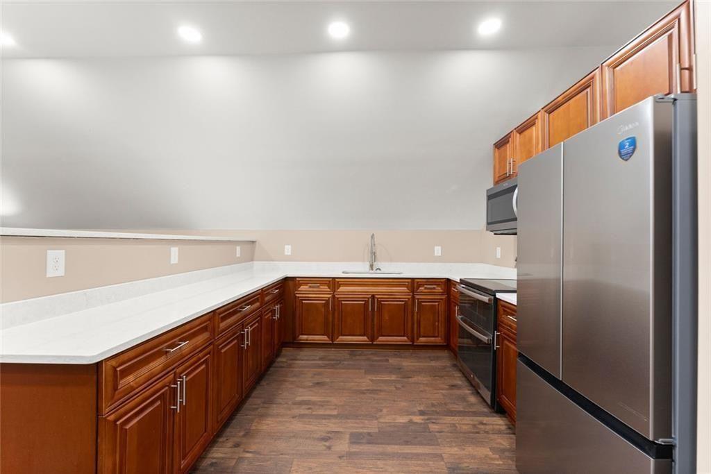 152 Grover Taylor Road Demorest, GA 30535 - Photo 41 of 68 a kitchen with stainless steel appliances granite countertop a refrigerator and a sink