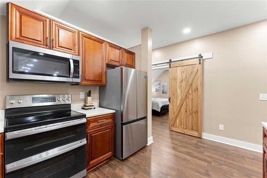 152 Grover Taylor Road Demorest, GA 30535 - Photo 45 of 68 a kitchen with stainless steel appliances granite countertop a refrigerator and microwave