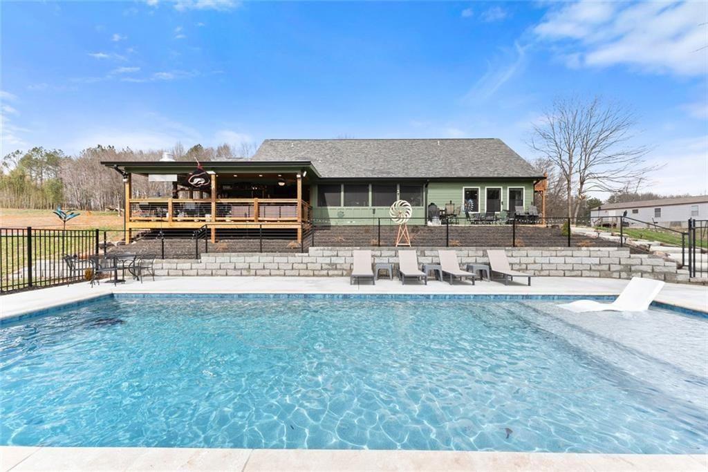 152 Grover Taylor Road Demorest, GA 30535 - Photo 56 of 68 a front view of a house with swimming pool having outdoor seating