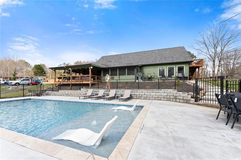 152 Grover Taylor Road Demorest, GA 30535 - Photo 57 of 68 a view of a swimming pool with outdoor seating