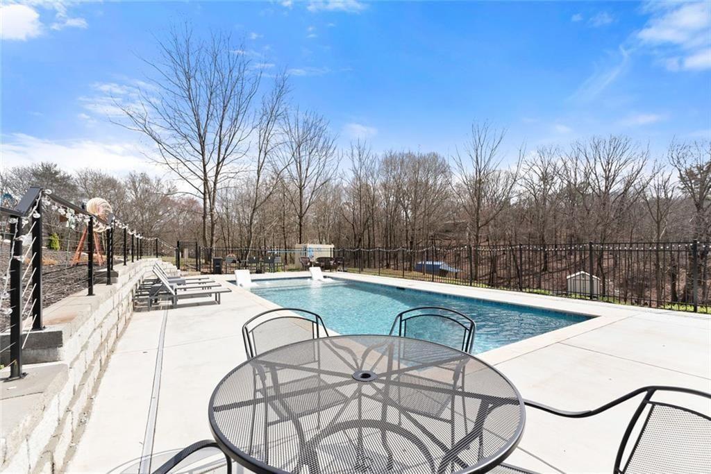 152 Grover Taylor Road Demorest, GA 30535 - Photo 60 of 68 a view of a swimming pool with a patio