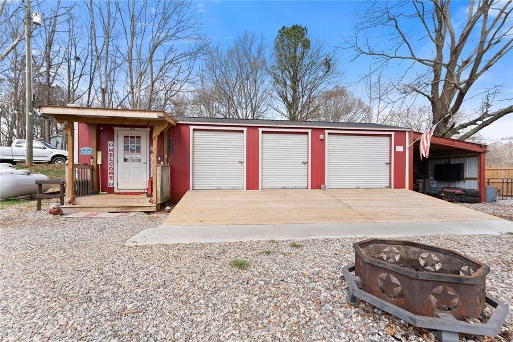 152 Grover Taylor Road Demorest, GA 30535 - Photo 62 of 68 a view of a house with a yard and garage