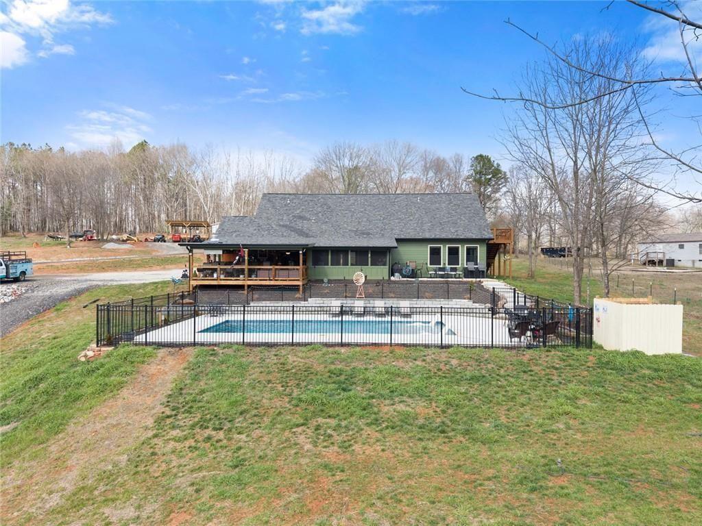152 Grover Taylor Road Demorest, GA 30535 - Photo 63 of 68 a view of a house with swimming pool and sitting area
