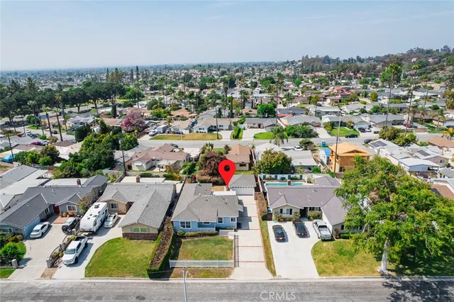 an aerial view of residential houses with outdoor space