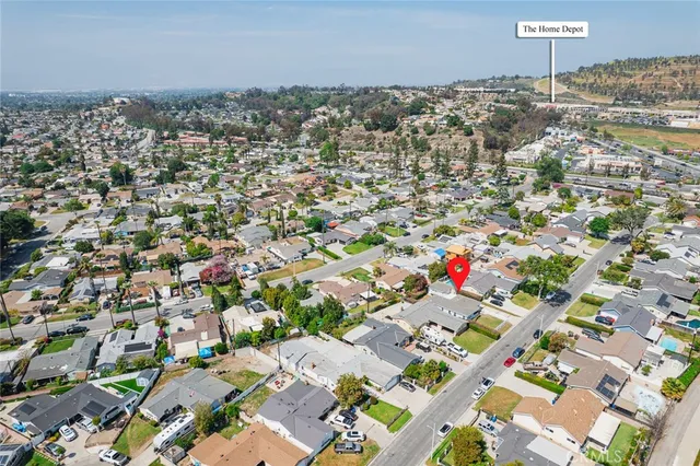 an empty room with a view of a kitchen