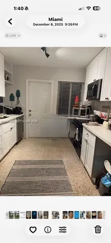 a view of kitchen with furniture and flat screen tv