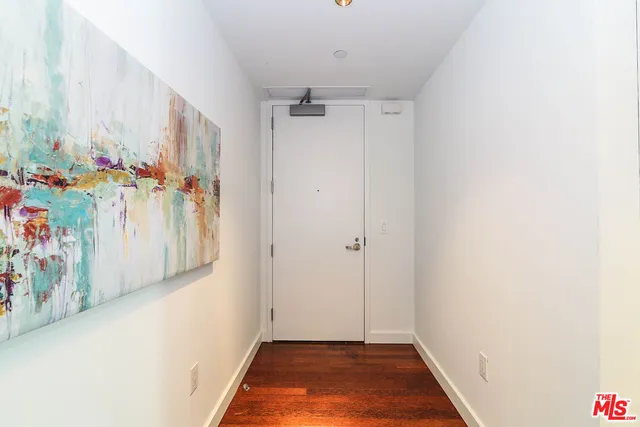 a view of an entryway with wooden floor