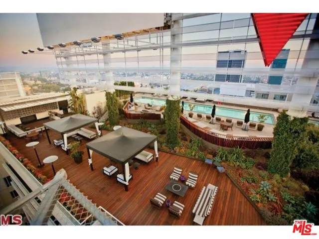 a aerial view of a chairs and table on the terrace