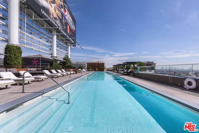 a view of a swimming pool with chairs