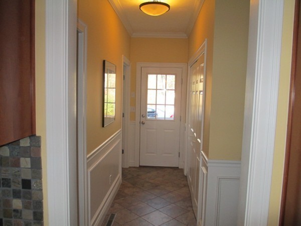 23 Spring Street Rehoboth, MA 02769 - Photo 14 of 27 a view of a hallway with wooden floor and windows