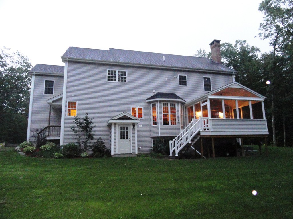 23 Spring Street Rehoboth, MA 02769 - Photo 2 of 27 a front view of house with yard and green space