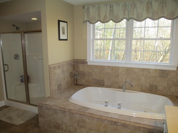 23 Spring Street Rehoboth, MA 02769 - Photo 22 of 27 a bathroom with a bathtub and a shower