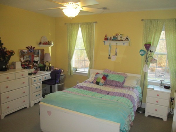 23 Spring Street Rehoboth, MA 02769 - Photo 24 of 27 a bedroom with a bed and a chandelier