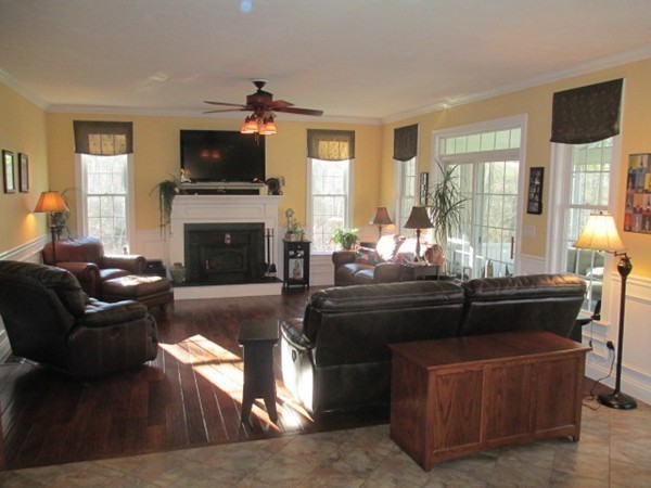 23 Spring Street Rehoboth, MA 02769 - Photo 8 of 27 a living room with furniture a fireplace and a flat screen tv