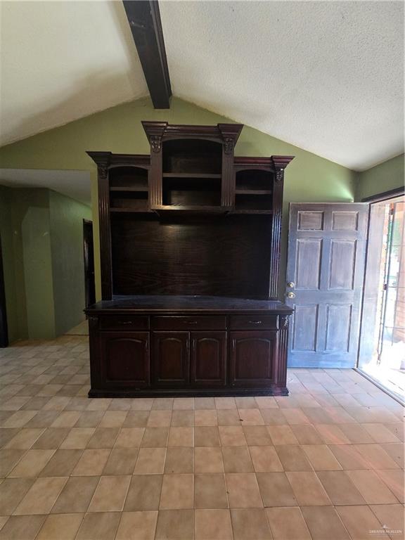 519 East 3rd Street Sullivan City, TX 78595 - Photo 6 of 12 Detailed view of beam ceiling