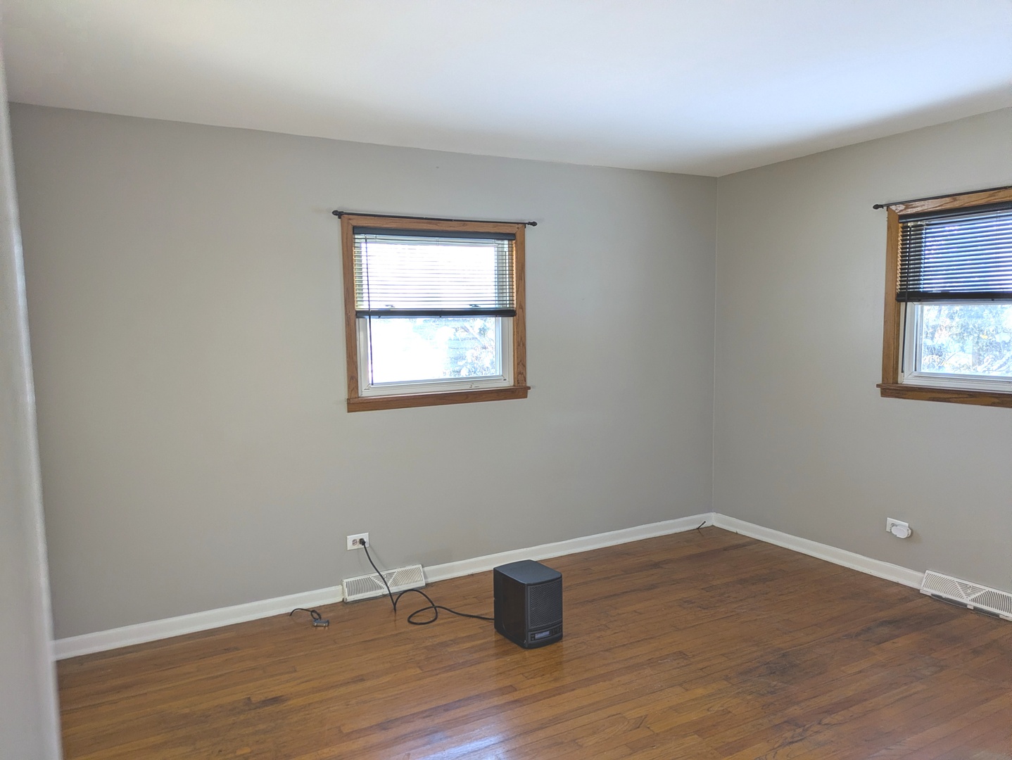 21W230 Pershing Avenue Lombard, IL 60148 - Photo 12 of 41 a room with a wooden floor and a window