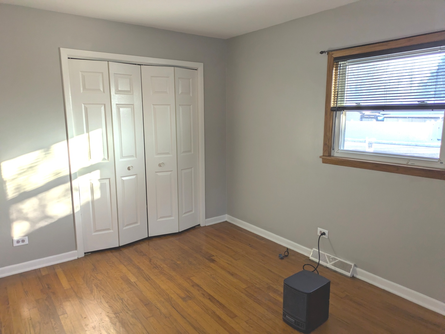 21W230 Pershing Avenue Lombard, IL 60148 - Photo 13 of 41 an empty room with wooden floor and windows