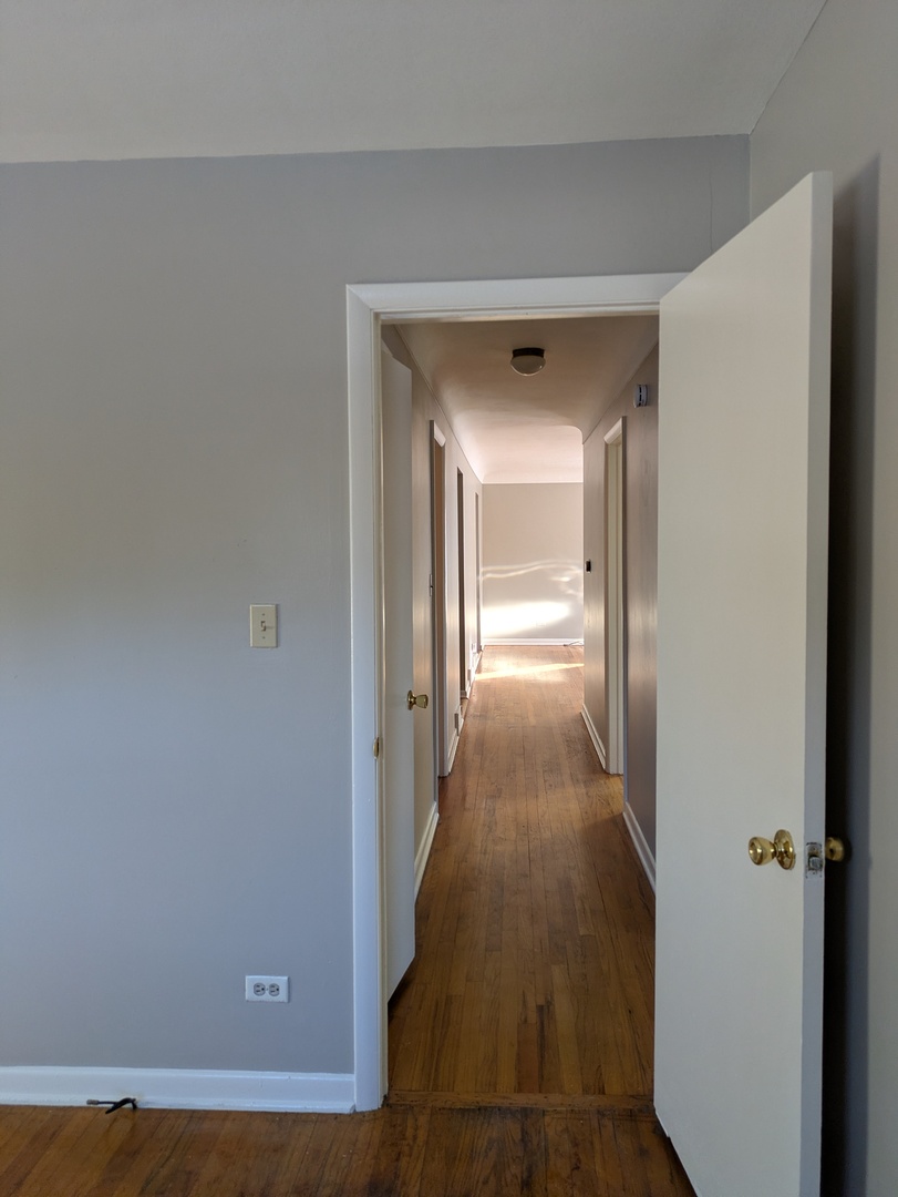 21W230 Pershing Avenue Lombard, IL 60148 - Photo 15 of 41 a view of a hallway with wooden floor