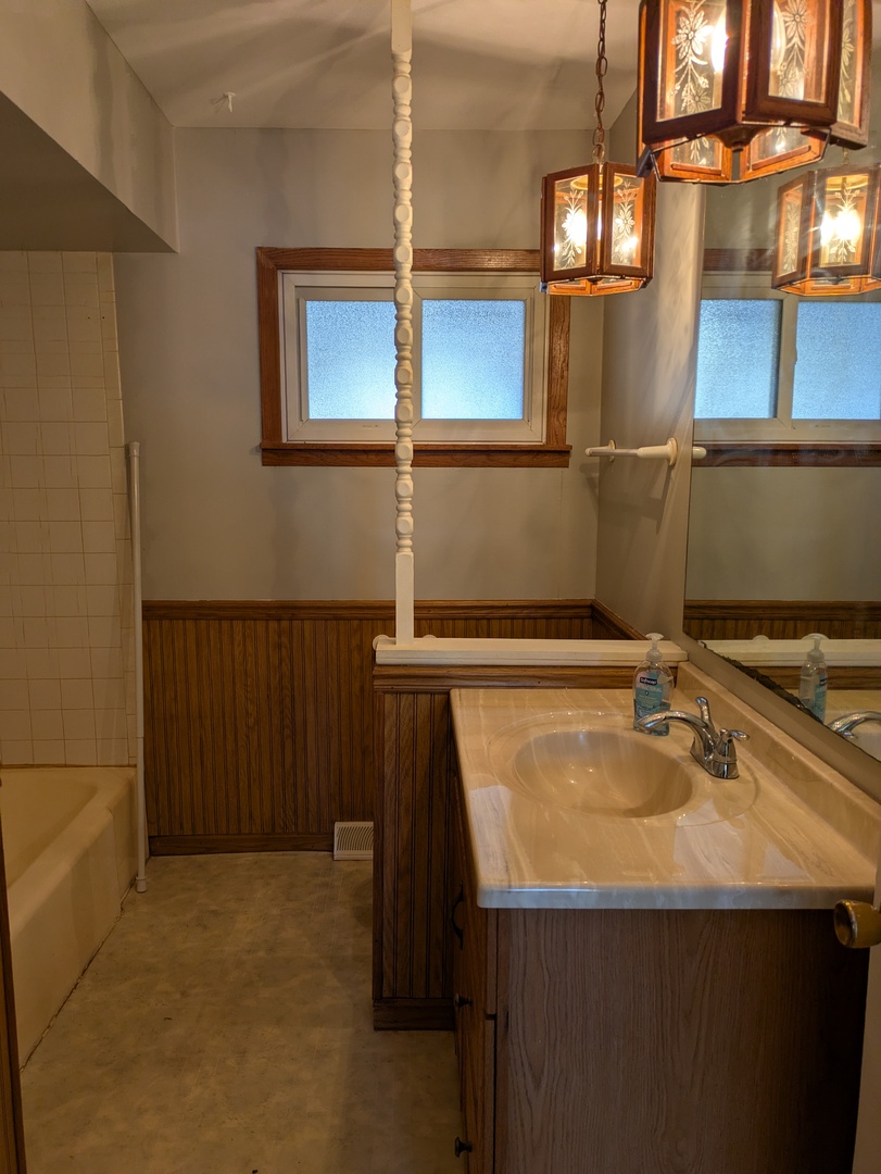 21W230 Pershing Avenue Lombard, IL 60148 - Photo 39 of 41 a bathroom with a sink and a mirror