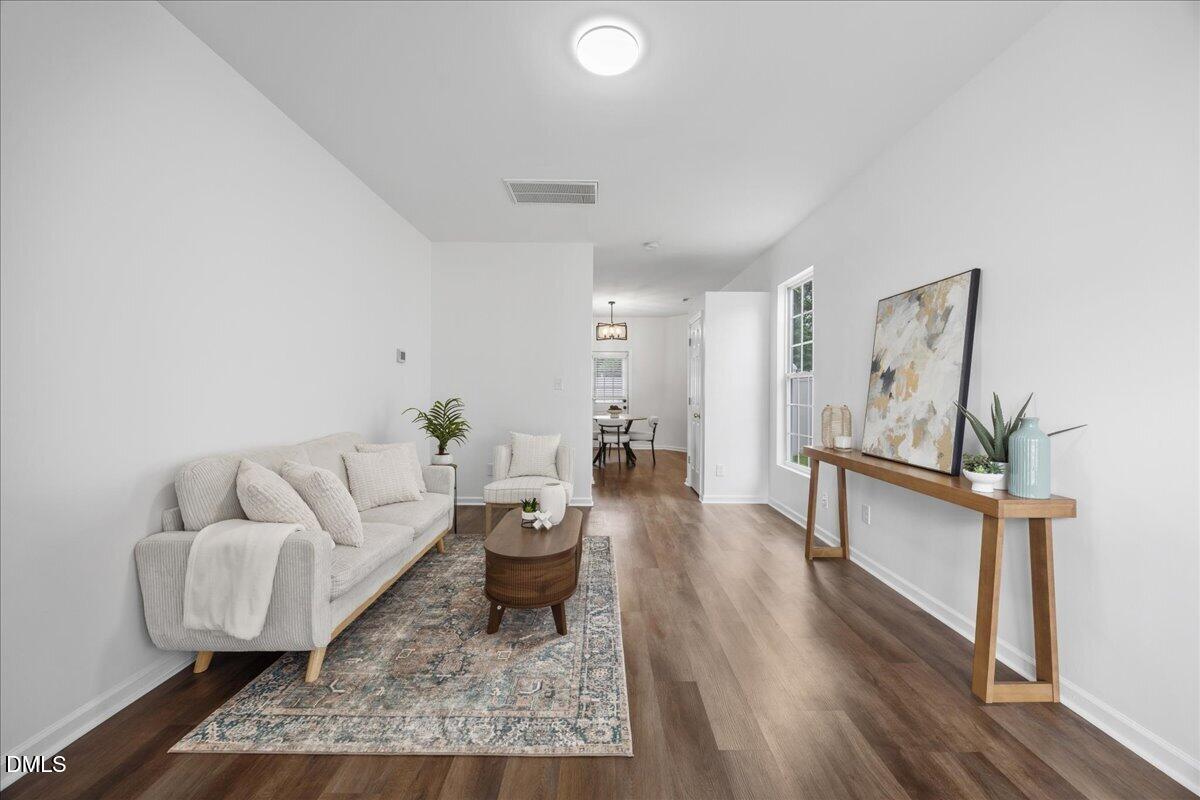 3831 Pin Oak Road Raleigh, NC 27604 - Photo 3 of 24 a living room with furniture and a wooden floor