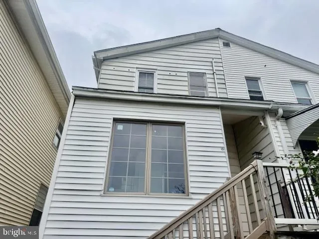 a view of a house with wooden stairs