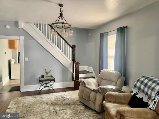 a view of wooden floor and windows in a room