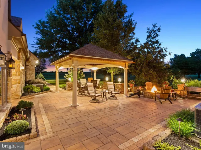 a living room with furniture and large windows
