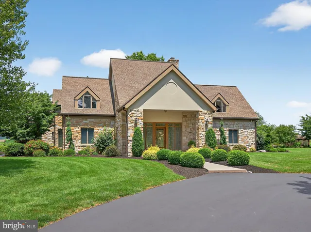 a bedroom with a bed and a chair