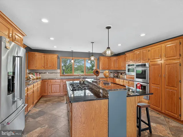 a bedroom with furniture and a flat screen tv