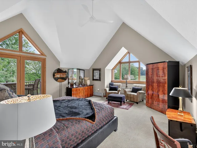 a view of a house with a yard and potted plants
