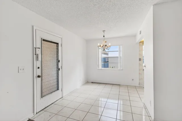 a kitchen with stainless steel appliances granite countertop white cabinets stove a sink and dishwasher