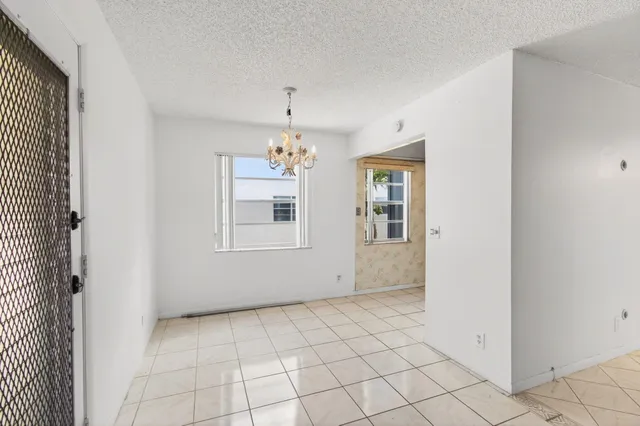 a kitchen with stainless steel appliances white cabinets and a sink