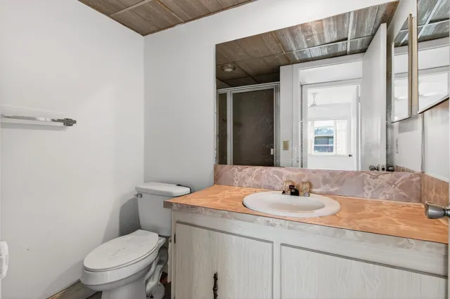 a white bath tub sitting next to a white toilet